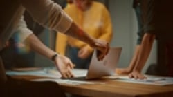 hands, papers and laptop